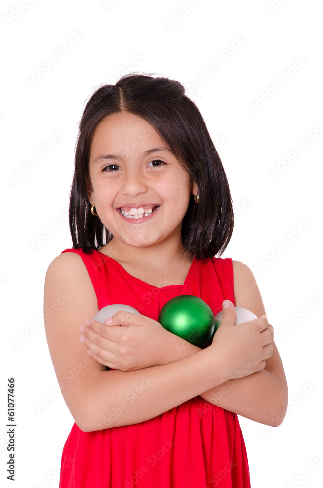 Child Hand holding a christmas ornament Child Hand holding a christmas ornament