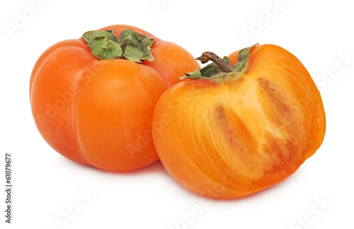 One whole and a half of ripe persimmon (isolated)