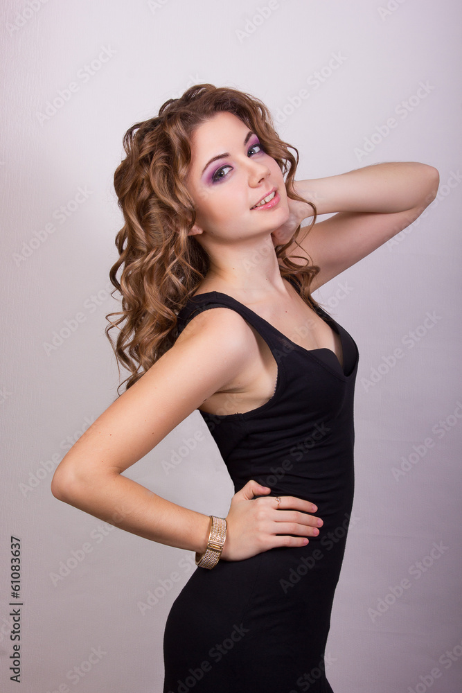 Portrait of a beautiful young girl with brown curly hair Portrait of a beautiful young girl with brown curly hair