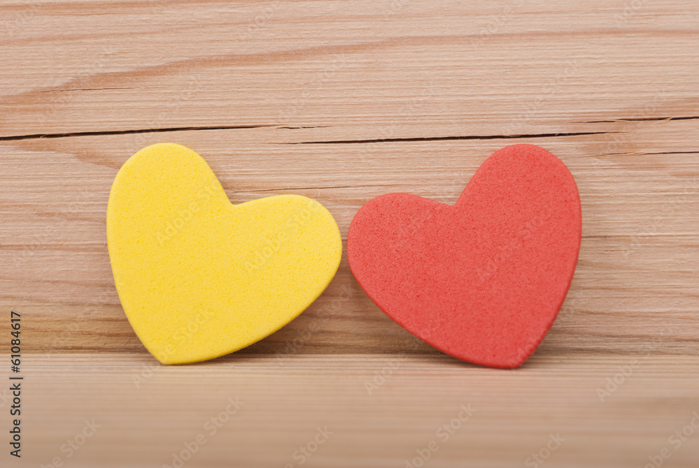 Two hearts on a wooden background. Two hearts on a wooden background.
