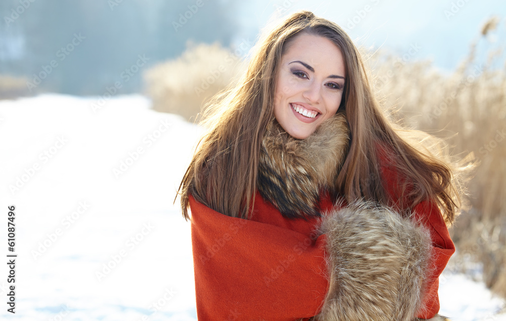 beautiful girl freezing in winter park. pictures in warm colors beautiful girl freezing in winter park. pictures in warm colors