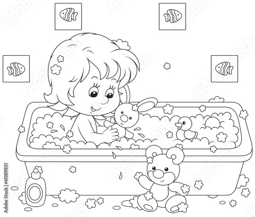 Girl bathing with toys