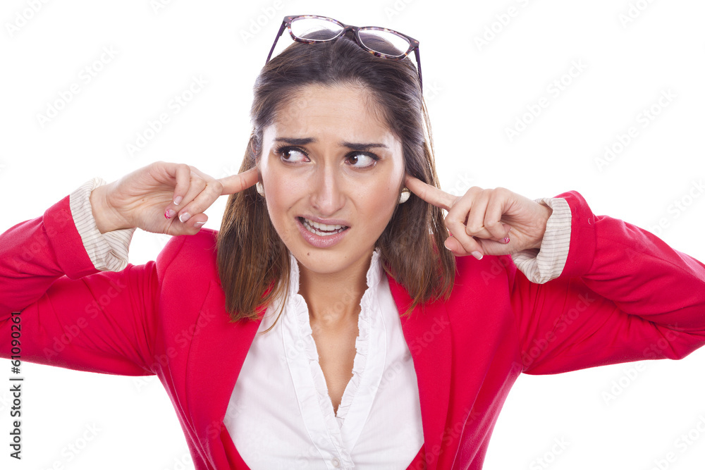 Portrait of a unhappy young woman covering her ears and screamin Portrait of a unhappy young woman covering her ears and screamin