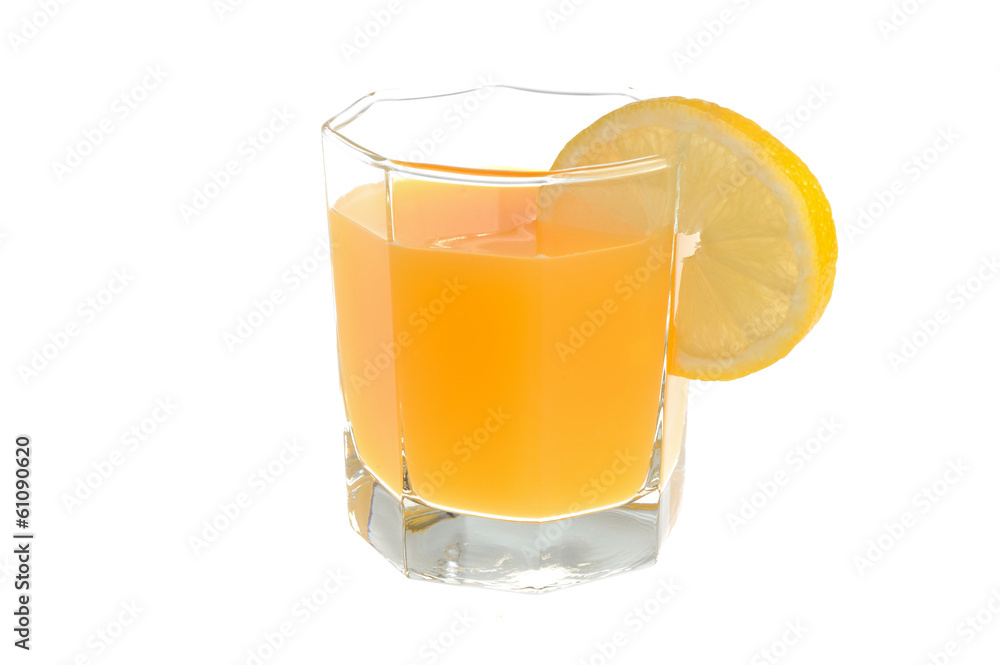 Glass with a slice of lemon filled with citrus juice isolated Glass with a slice of lemon filled with citrus juice isolated