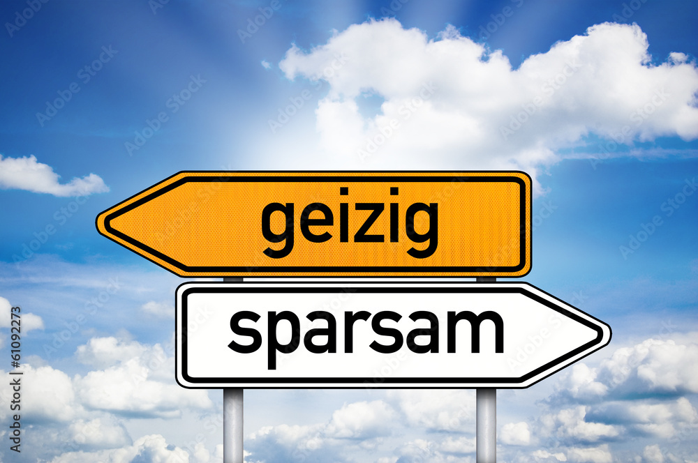 Fototapeta premium Wegweiser mit geizig und sparsam