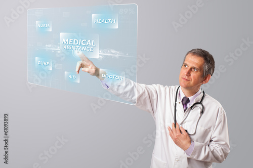 Middle aged doctor pressing modern medical type of button