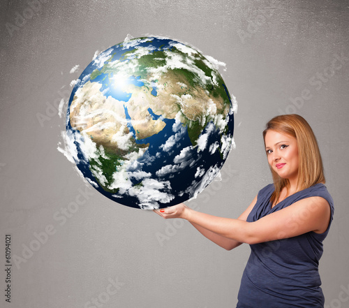 Pretty girl holding 3d planet earth photo