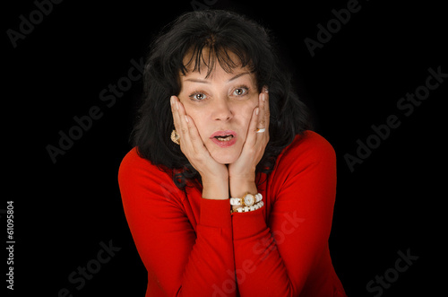 Фотография Astonished woman in red sweater