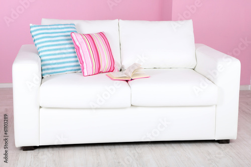 White sofa in room on pink background