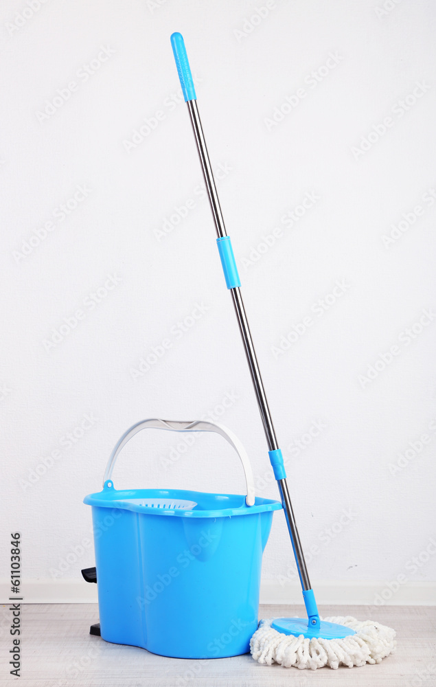 Floor mop and bucket for washing in room Floor mop and bucket for washing in room