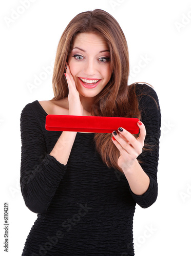 Girl looks at box with jewe...