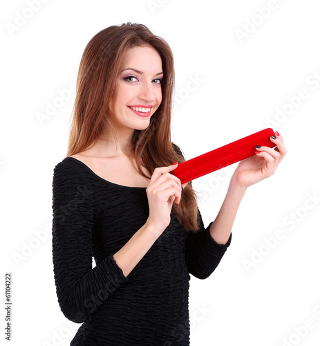 Girl looks at box with jewe...