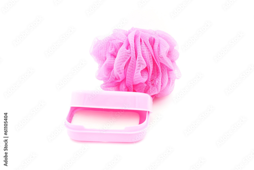 pink soapbox with soap and shower scrubber on white background pink soapbox with soap and shower scrubber on white background
