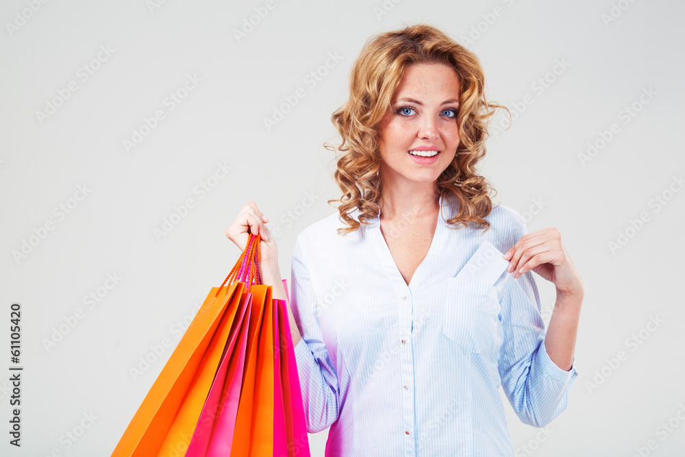 woman holding blank card and bags woman holding blank card and bags