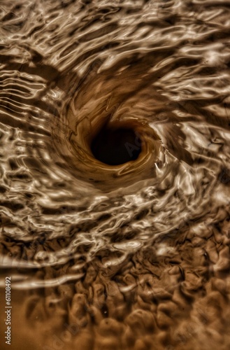 water swirling down a hole © ___11___