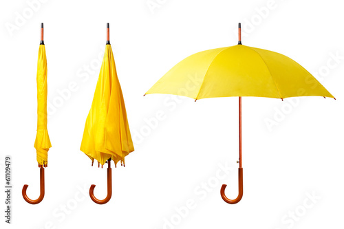 Set of yellow umbrellas isolated on white background photo
