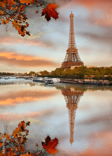 Eiffel Tower with autumn leaves in Paris, France