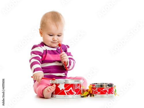 Baby girl playing musical toy