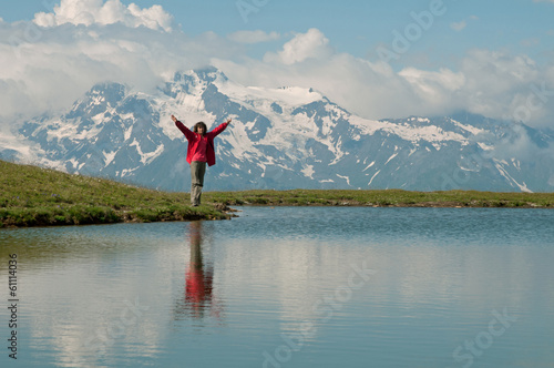 Woman near mountain lake - Mestia, Georgia photo