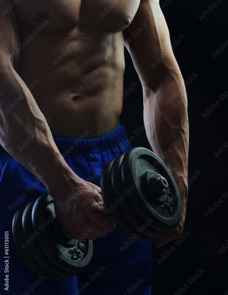 Body builder champion posing in studio Body builder champion posing in studio