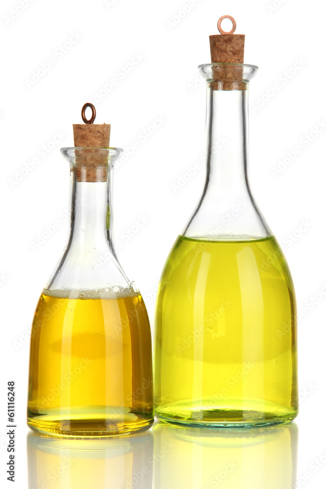 Original glass bottles with salad dressing isolated on white Original glass bottles with salad dressing isolated on white