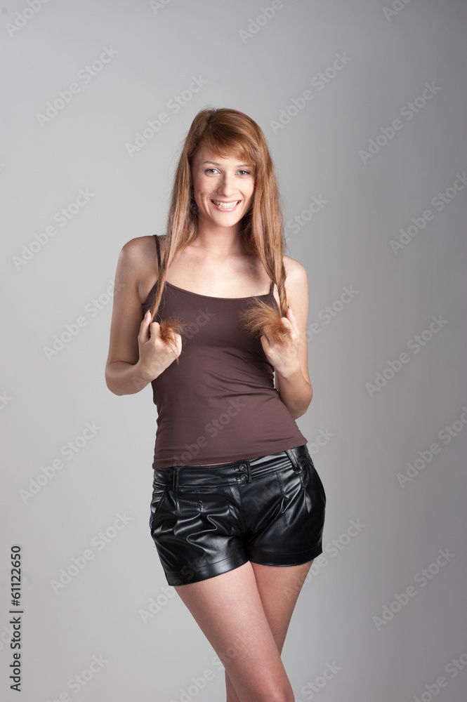 Fototapeta premium cheerful casual girl on gray