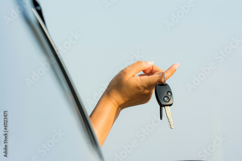driver holding car keys driving