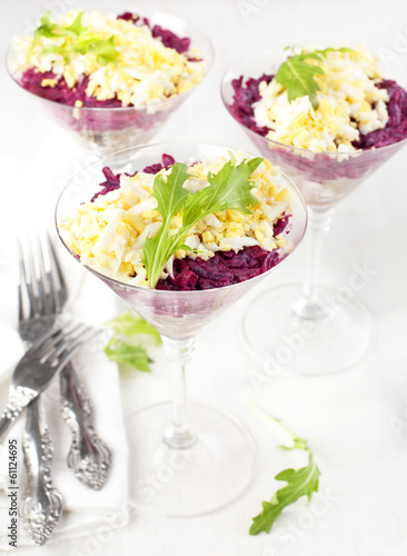 Beetroot salad with herring in a glass