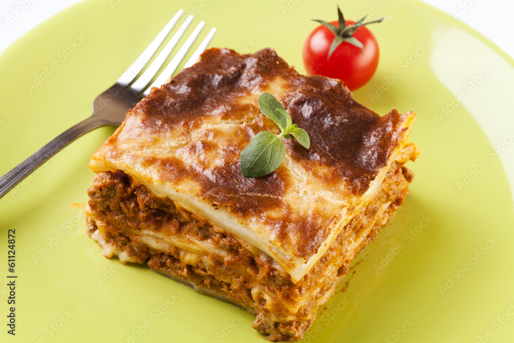 Portion of tasty lasagna on a plate Portion of tasty lasagna on a plate