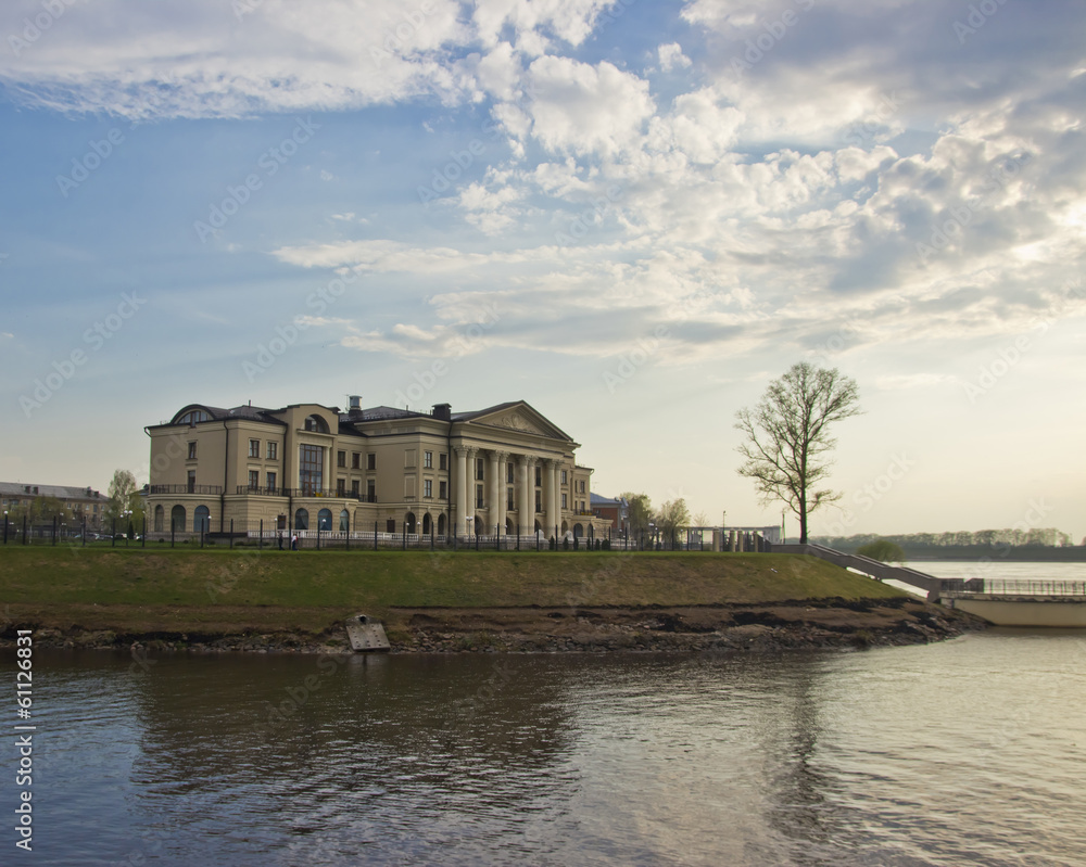 Obraz premium Landscape with oldstyle building at sunset