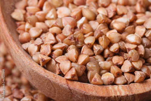 brown buckwheat groats close-up in a wooden bowl