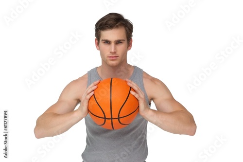 Fit man holding basketball about to throw