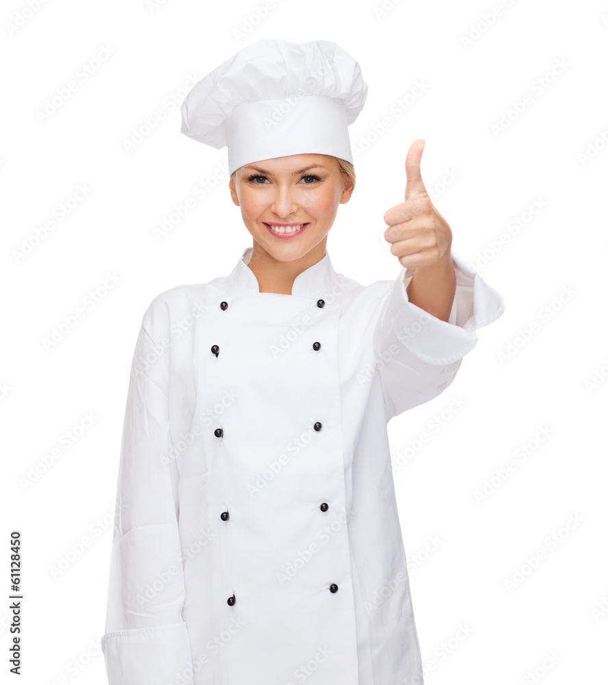 smiling female chef showing thumbs up smiling female chef showing thumbs up