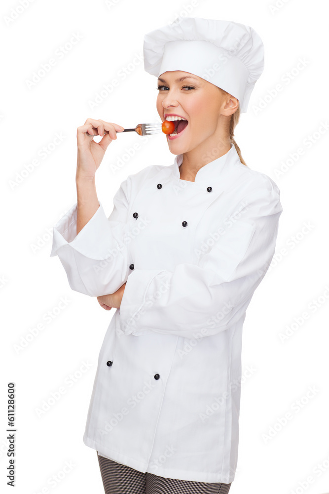 female chef, cook or baker with fork and tomato female chef, cook or baker with fork and tomato