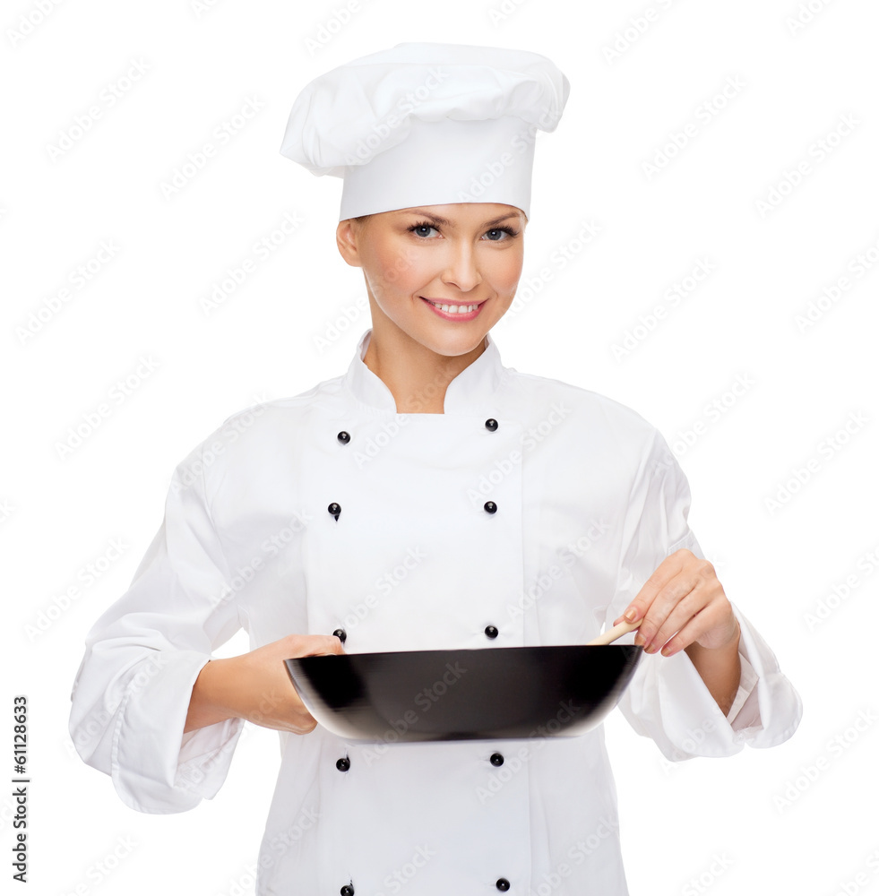 smiling female chef with pan and spoon smiling female chef with pan and spoon