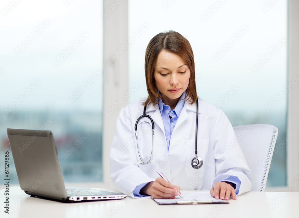 busy doctor with laptop computer and clipboard busy doctor with laptop computer and clipboard
