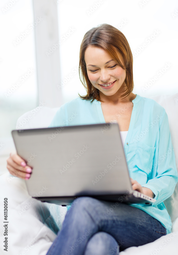 smiling woman with laptop computer at home smiling woman with laptop computer at home