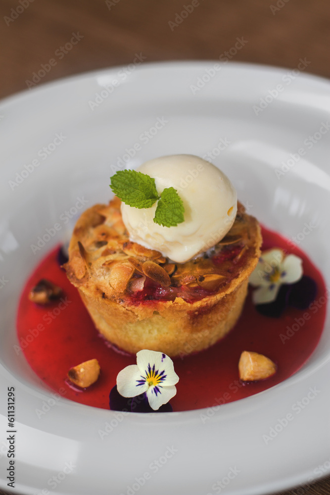 Image of tasty dessert with icecream and strawberries syrup in r Image of tasty dessert with icecream and strawberries syrup in r