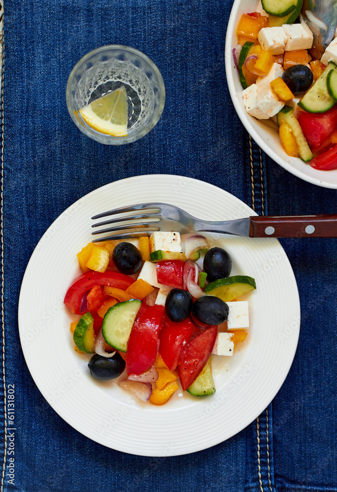 Greek salad with feta cheese, olives and vegetables Greek salad with feta cheese, olives and vegetables