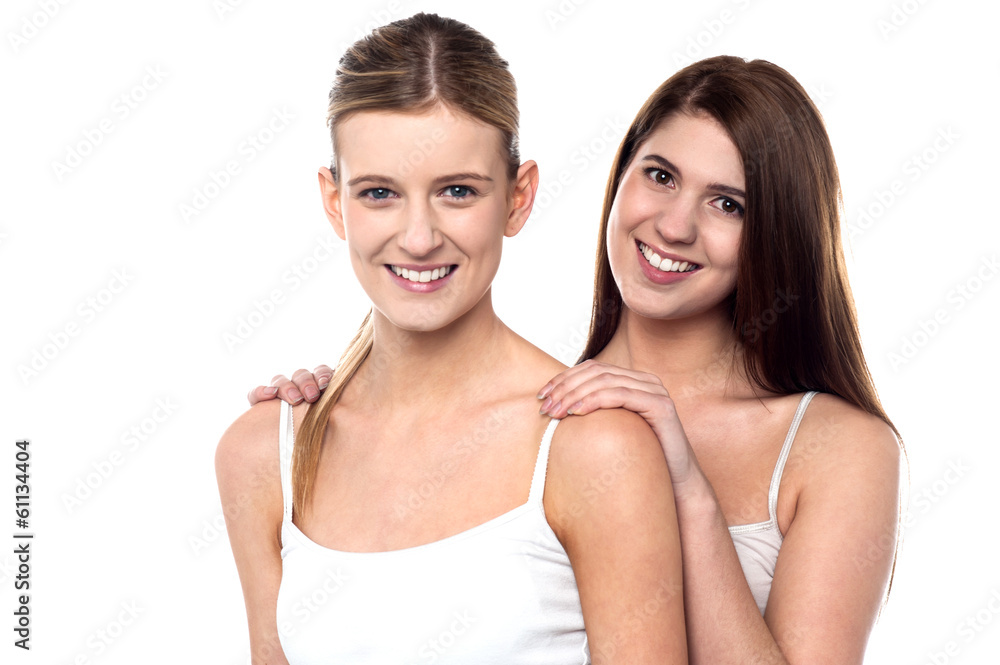 Two attractive girls posing in sleeveless spaghetti Two attractive girls posing in sleeveless spaghetti