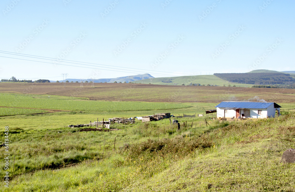 Land Prepared For Farming With African Hut In Foreground