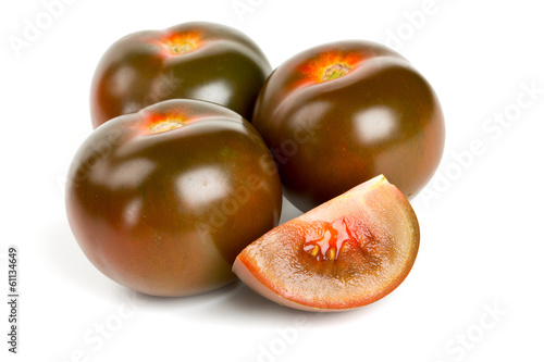kumato tomatoes isolated on white background photo