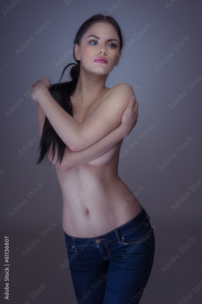Sexy Brunette Topless Woman Wearing Jeans Stock Photo | Adobe Stock