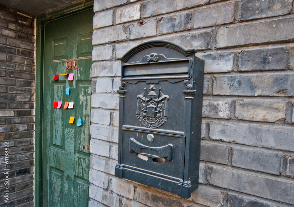 letter box next to green door in hutong area, Beijing, China