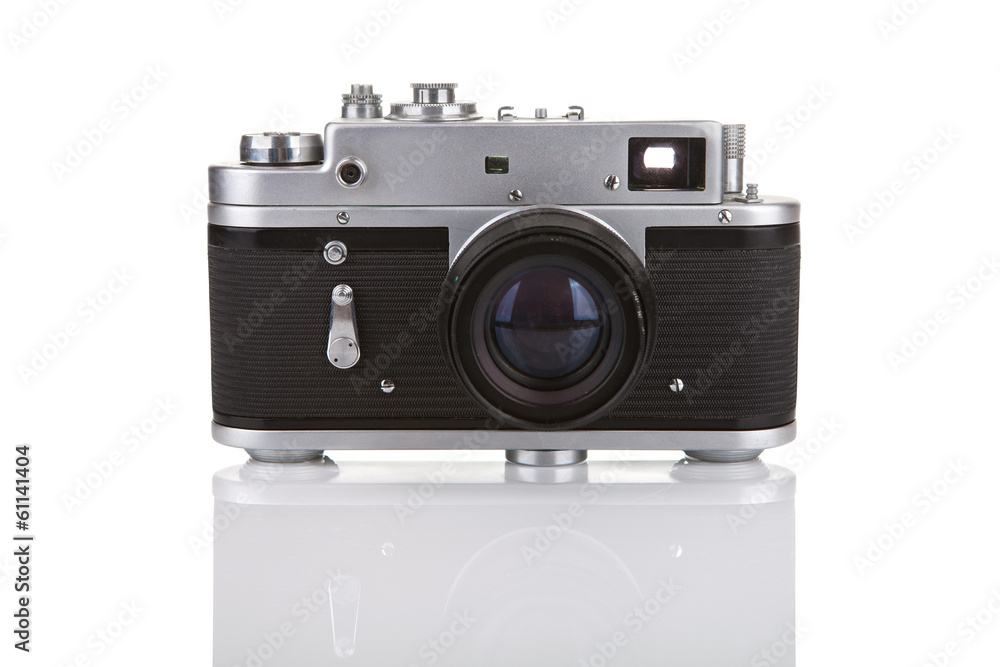 Old manual camera on white background with reflection Old manual camera on white background with reflection