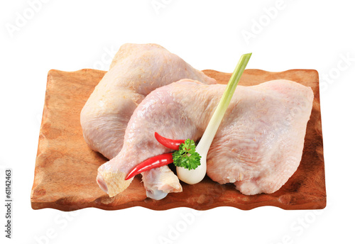 Raw chicken legs photo