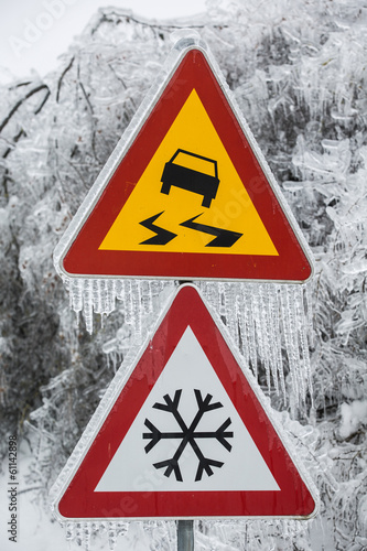 Dangerous and icy road with sleet covered trees
