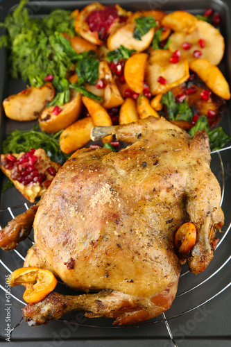 Whole roasted chicken with vegetables and fried potatoes