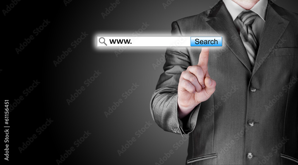 Businessman pushing virtual search bar Businessman pushing virtual search bar