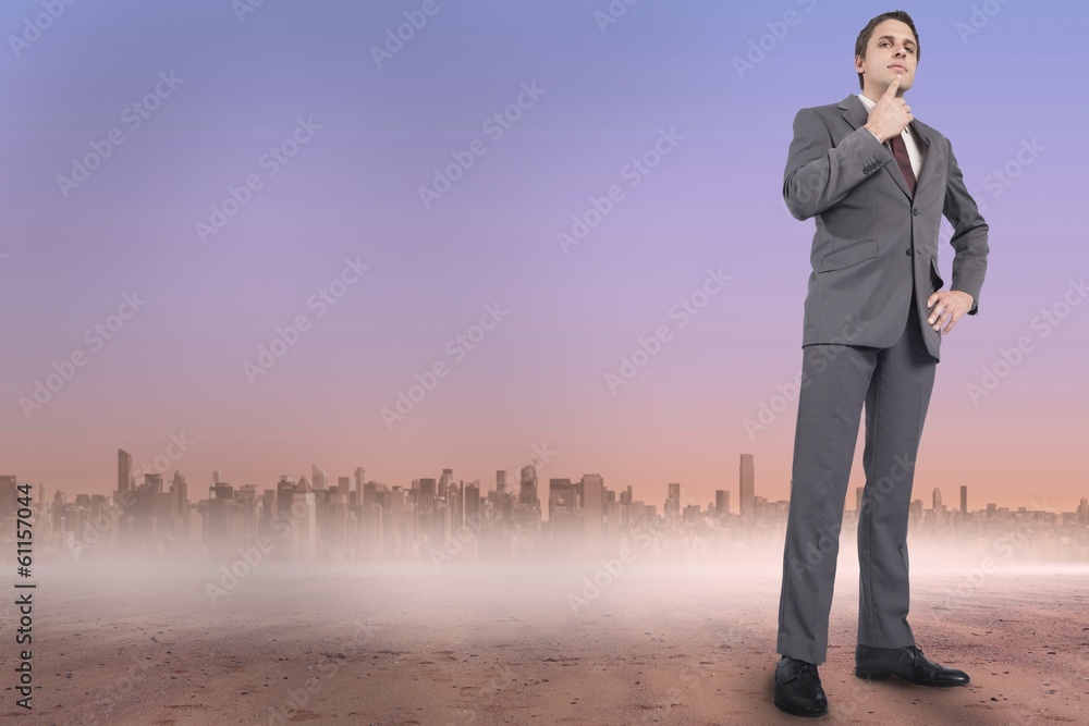 Composite image of thinking businessman with hand on chin Composite image of thinking businessman with hand on chin